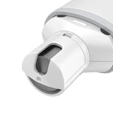 Close-up of the Pawbby Pet Nail Grinder, a white, cylindrical device with a partially open compartment showing a dark gray interior. Its design is sleek and modern, featuring smooth, rounded edges.